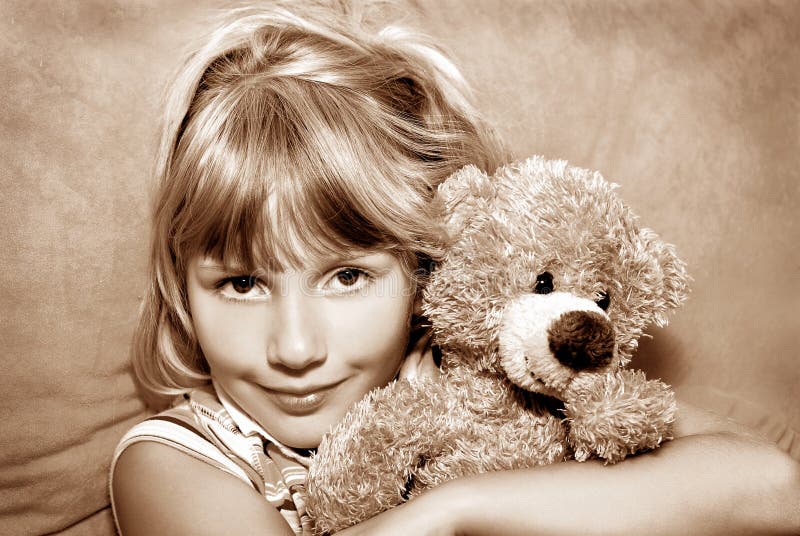 Young girl with her teddy bear