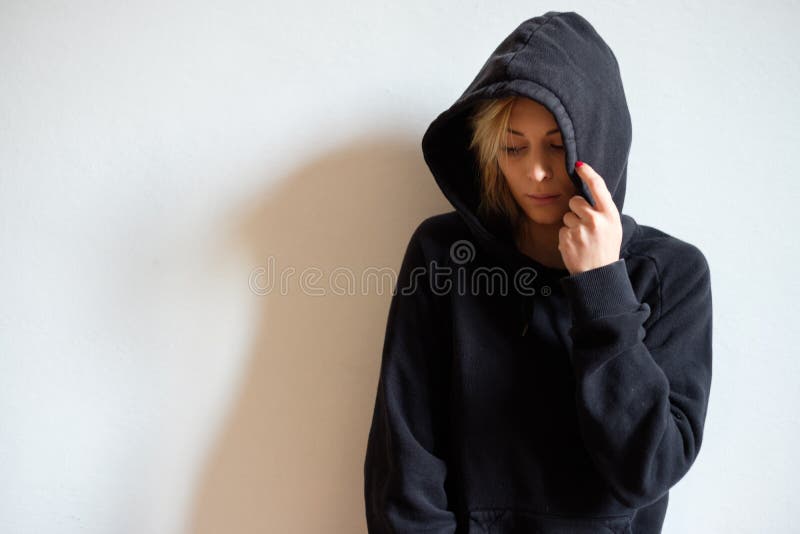 girl hiding in hoodie