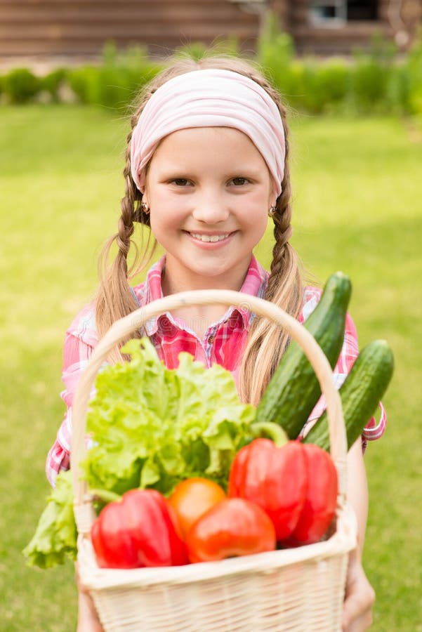 Young Girl Holding Basket of Vegetables and Looking at Camera Stock Photo Image of basket