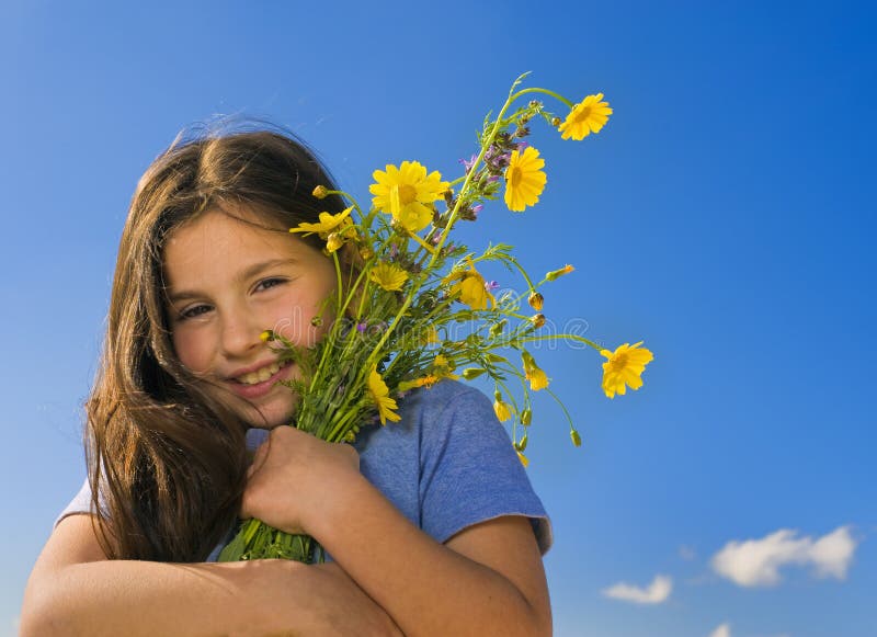 Young girl holding flowers