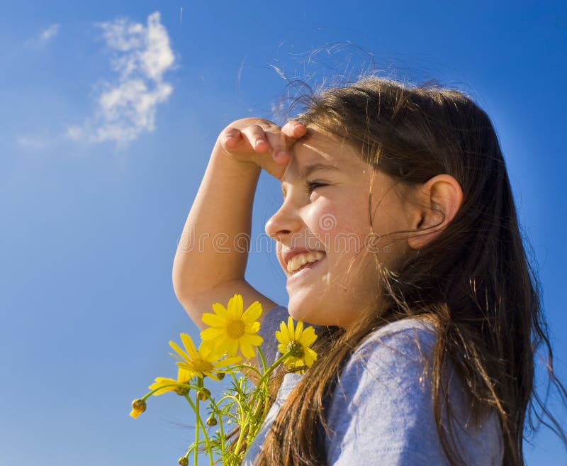 Young girl holding flowers