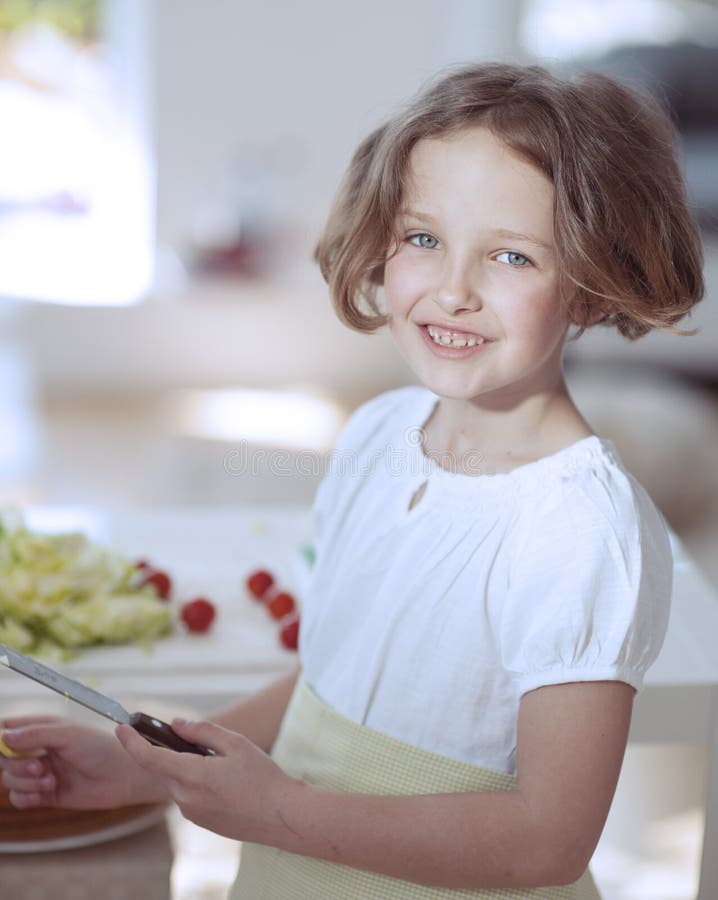 Young Girl Holding Knife in Kitchen Stock Image Image of happiness