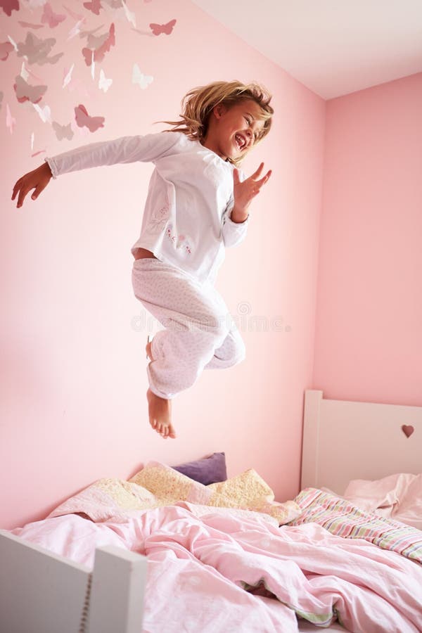 Young Girl Jumping On Her Bed Stock Photo Image of bedroom, child 33775550