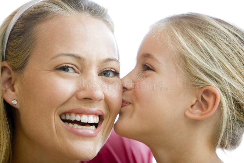 Young girl kissing smiling woman stock photos Young girl kissing smiling woman stock photos