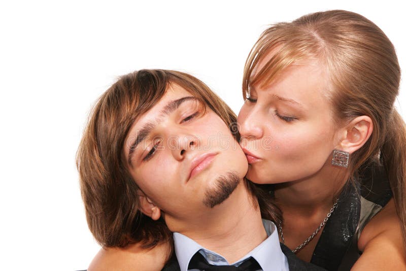 Young girl kissing young man