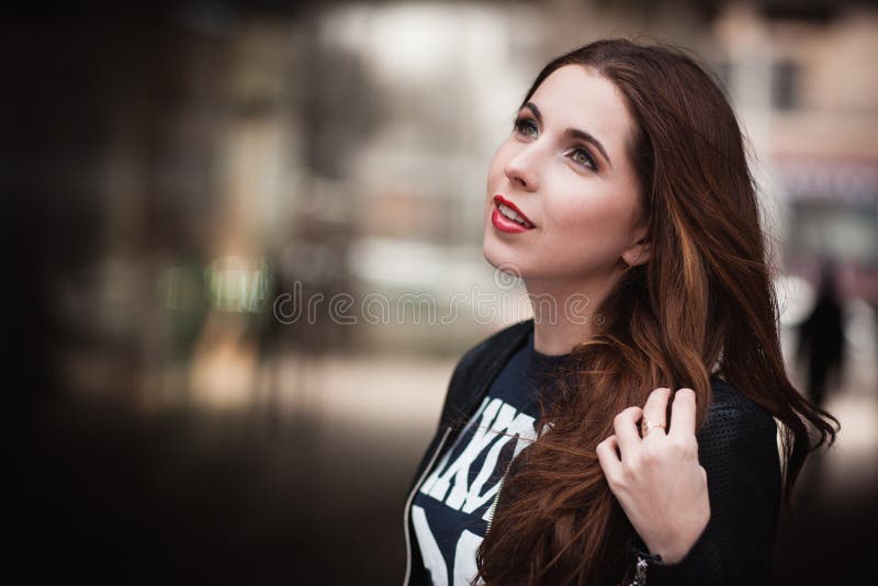 The young girl in a leather jacket smiles and dreams royalty free stock images The young girl in a leather jacket smiles and dreams royalty free stock images