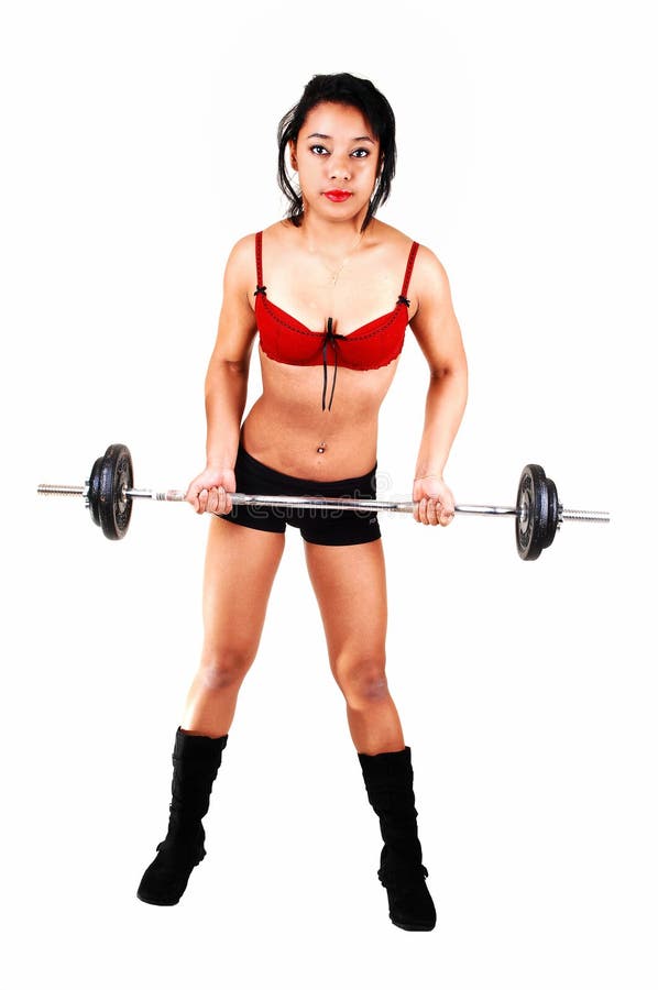 Young girl lifting weight.