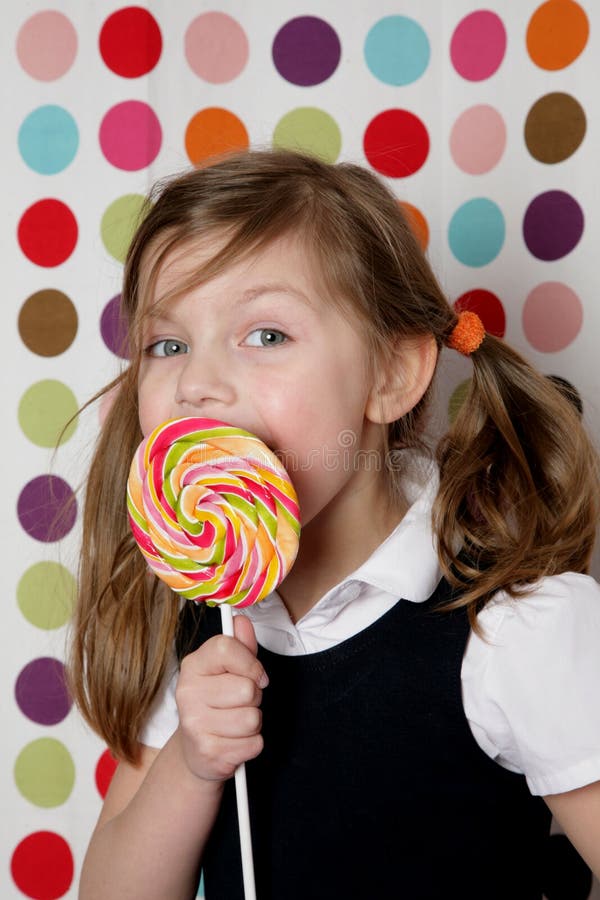 Young girl with lollipop stock image. Image of happy 23281935