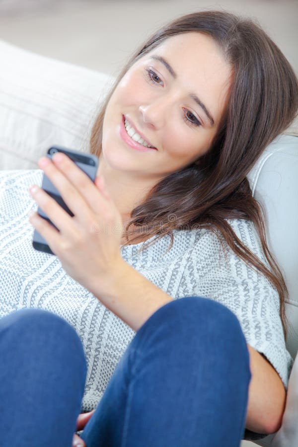 Young girl looking at cellphone royalty free stock photography