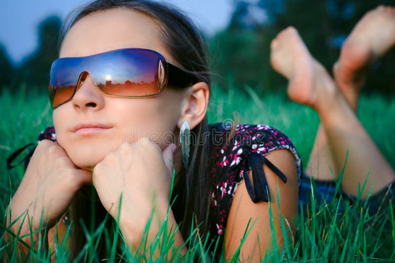 Young girl lying in grass