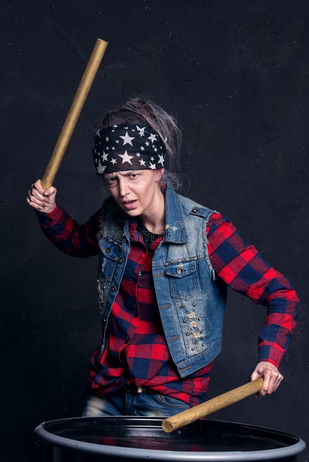 Young girl with makeup of senior woman. Elderly granny playing drums. royalty free stock photo Young girl with makeup of senior woman. Elderly granny playing drums. royalty free stock photo