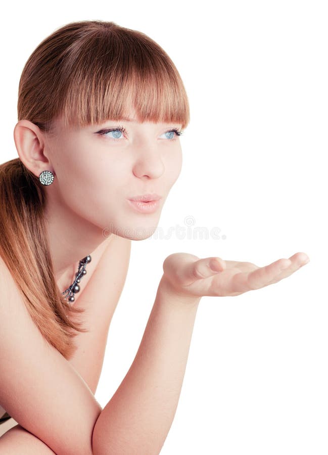 Young girl making blow kiss