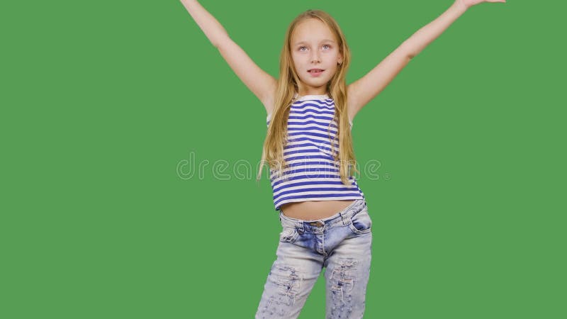 Young Girl Model Posing Front Camera on Green Background. Girl Teenager Smiling and Looking To Camera on Photo Session Stock Footage - Video of attractive, background: 157375806 