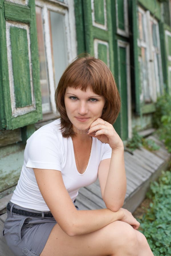 Young girl near house stock photo. Image of house, person 25999906