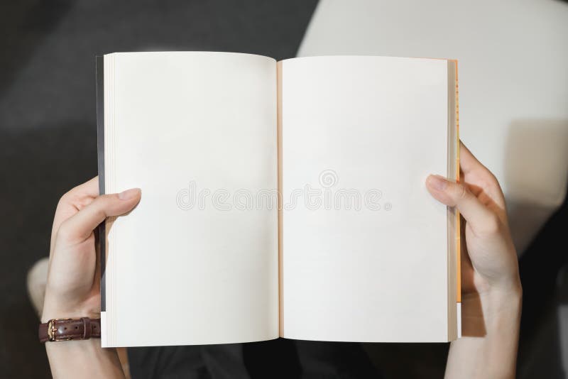 Young girl open the pages of the book empty. text for banner lifestyle and school. royalty free stock photos