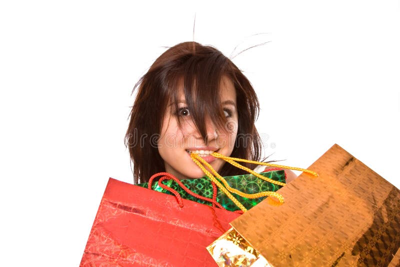 The young girl with packages after shopping.