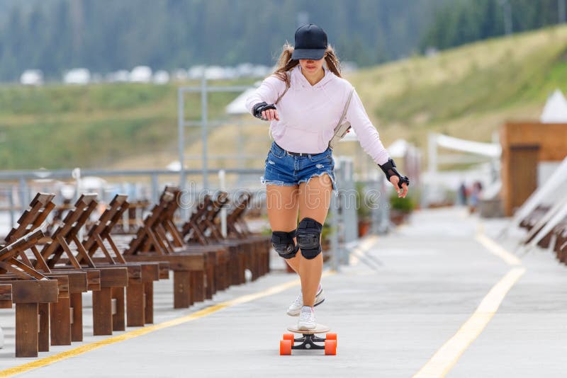 Young Girl with Pads Longboarding Near Beach Stock Image Image of