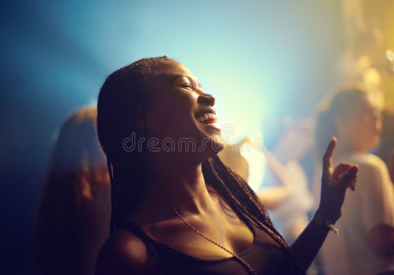 A young girl partying in a club and moving to the music. This concert was created for the sole purpose of this photo