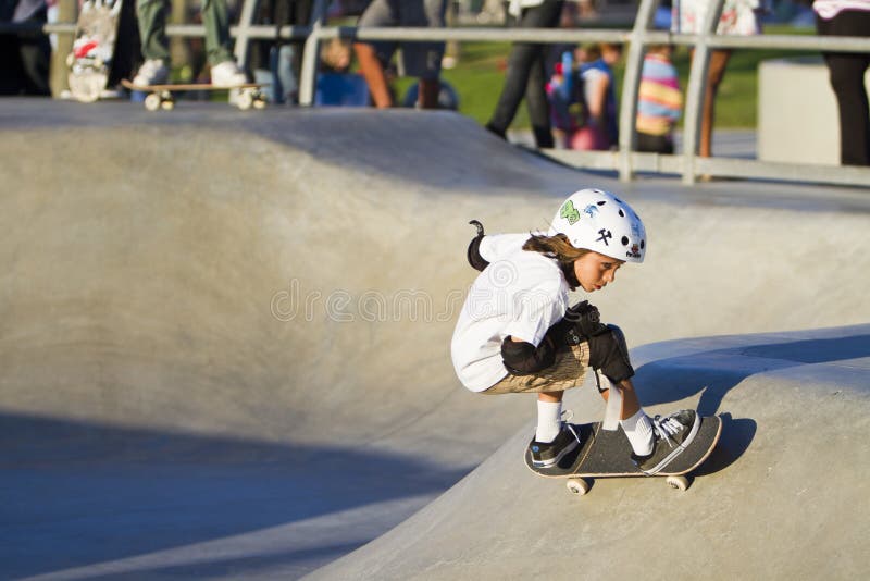 Young Girl Performing At Skateboard Park