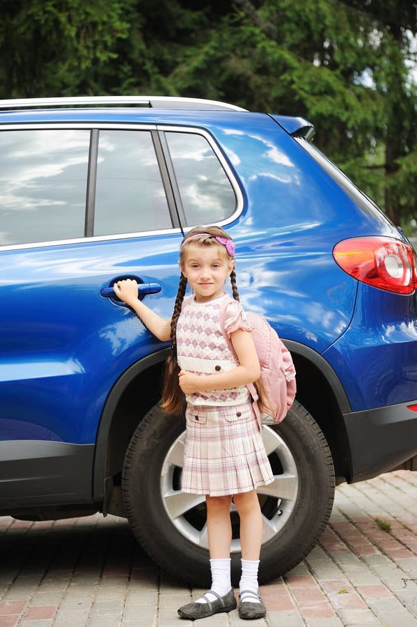 Young girl with pink bagpack ready to go to school