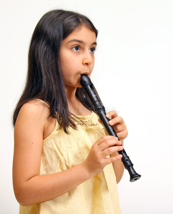 Young girl playing recorder