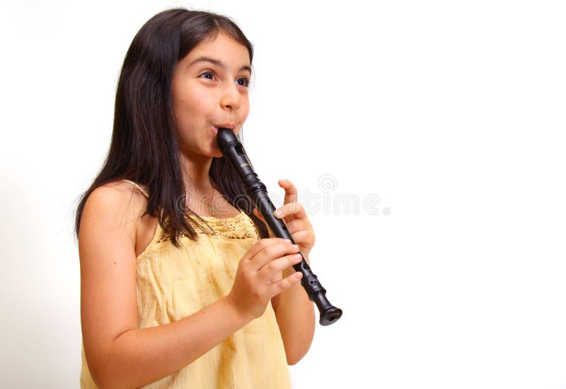 Young girl playing recorder