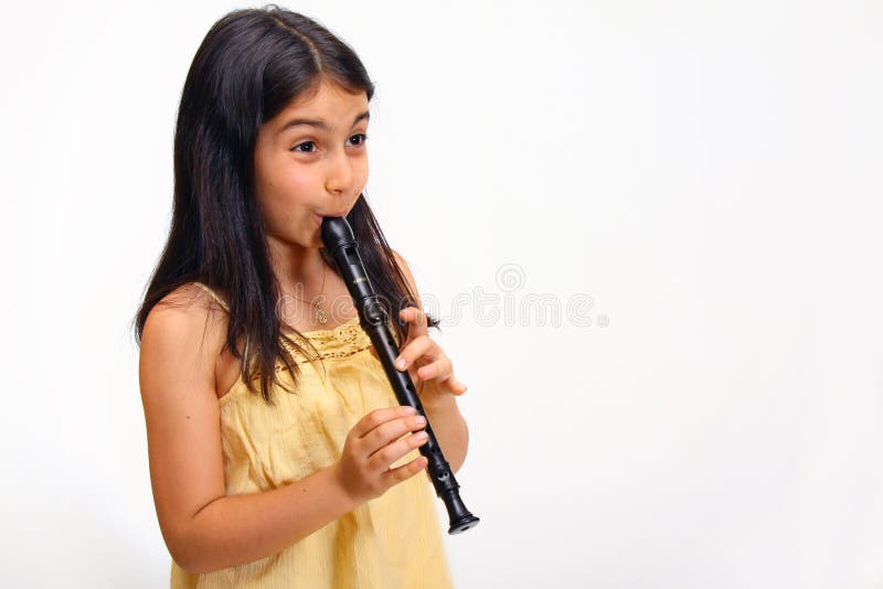 Young girl playing recorder