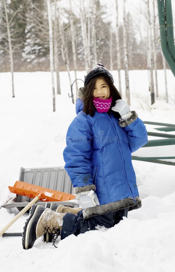 Young girl playing in the snow