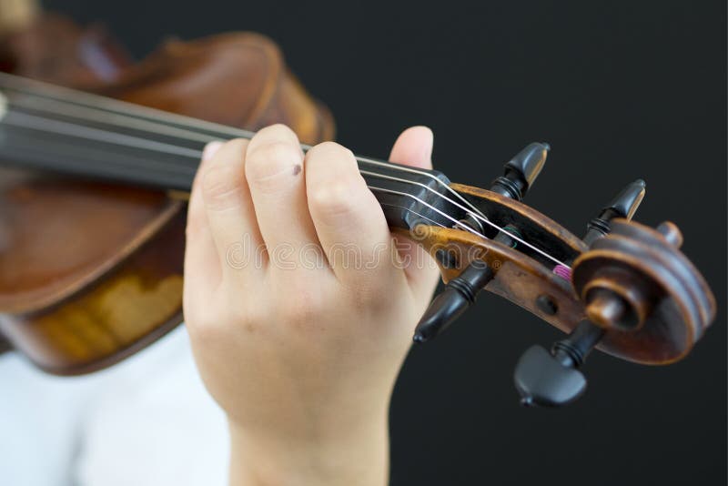 Young girl playing violin stock image