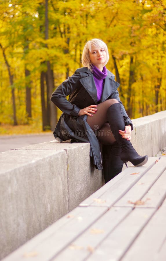 Young girl posing in autumn park