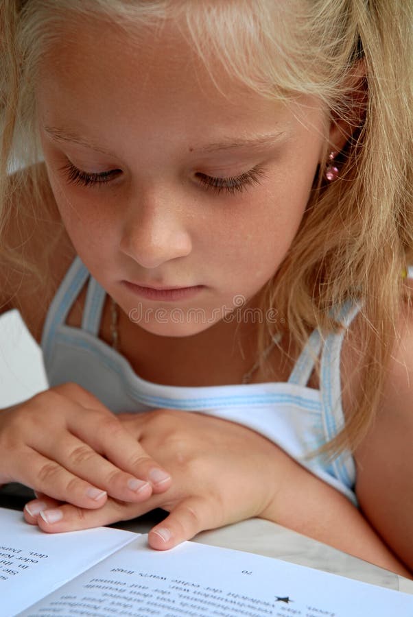 Young girl reading book