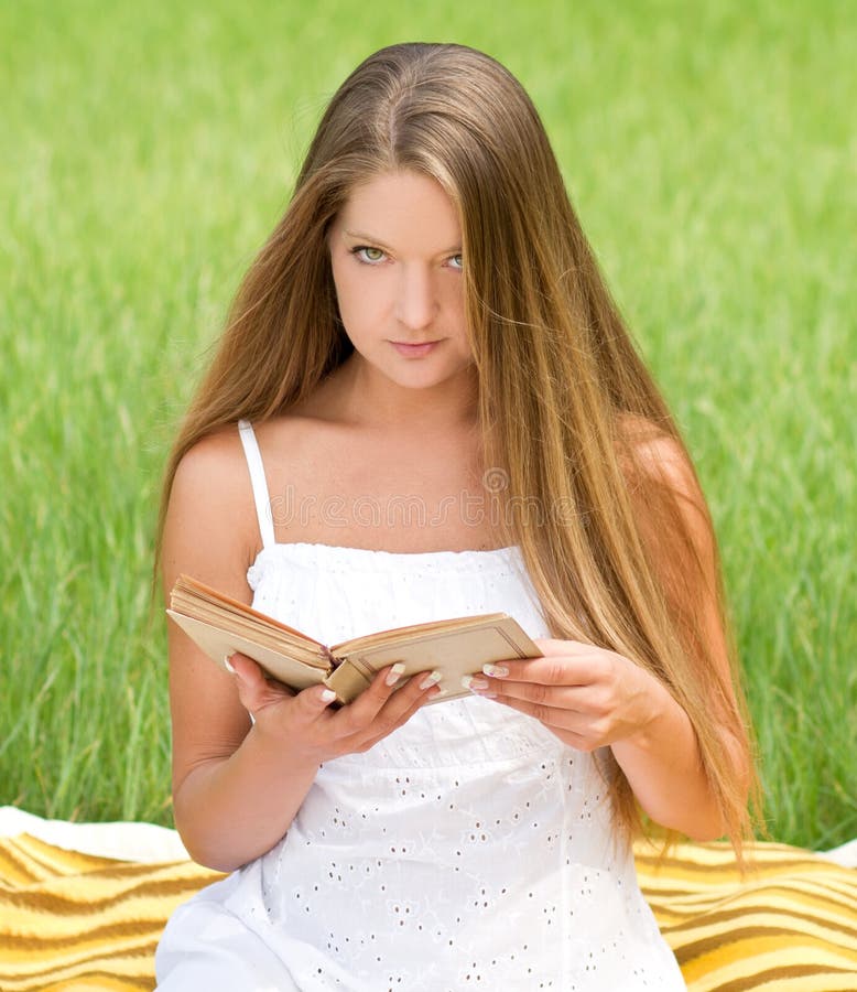 Young girl reading book