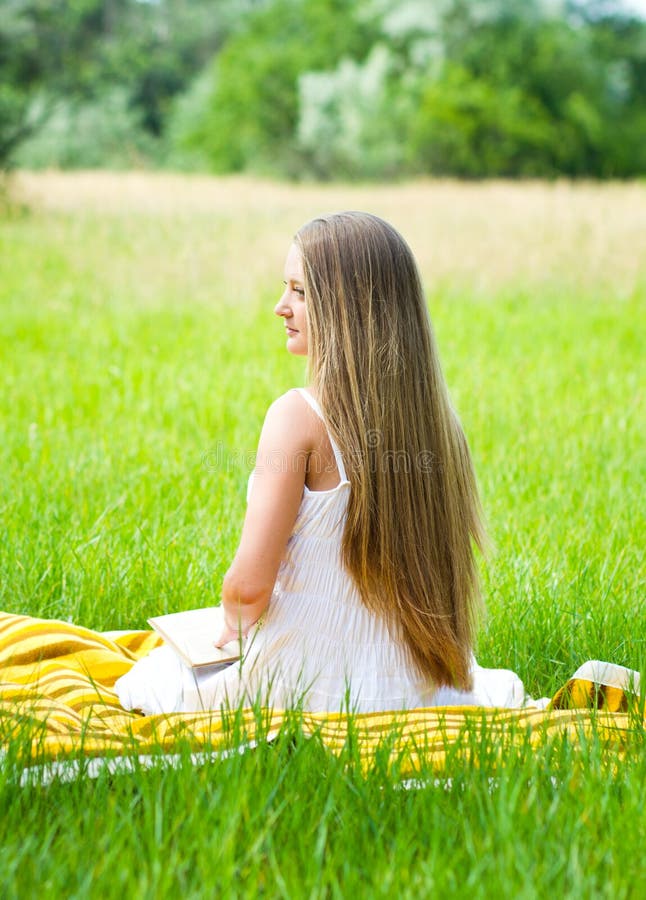 Young girl reading book