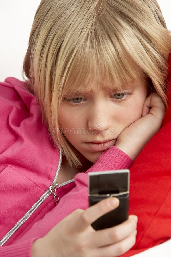 Young Girl Reading Text And Looking Worried royalty free stock photography Young Girl Reading Text And Looking Worried royalty free stock photography