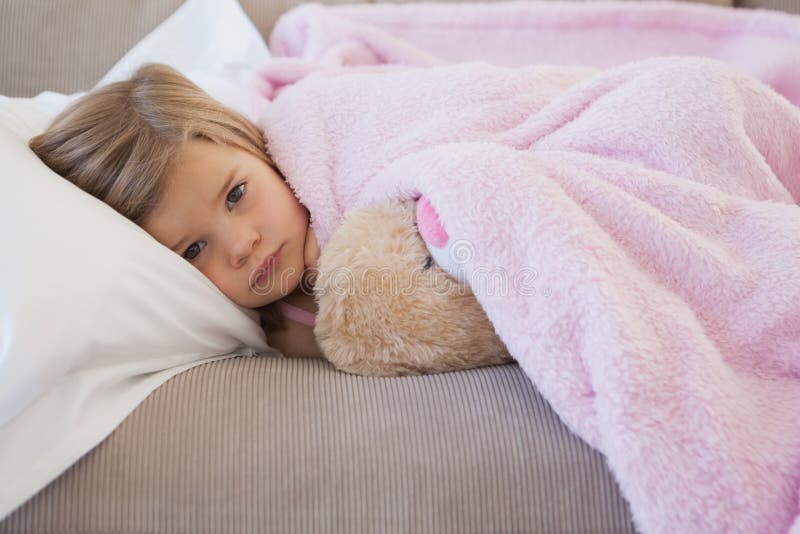 Young Girl Resting on Sofa with Stuffed Toy Stock Photo - Image of cute ...