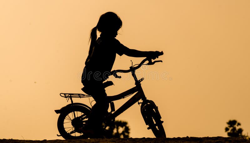 Young girl riding in the afternoon sun