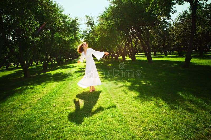 Young girl running in the garden