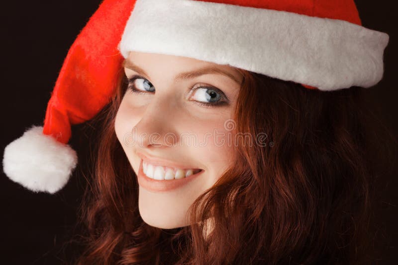 Young girl in santa claus hat