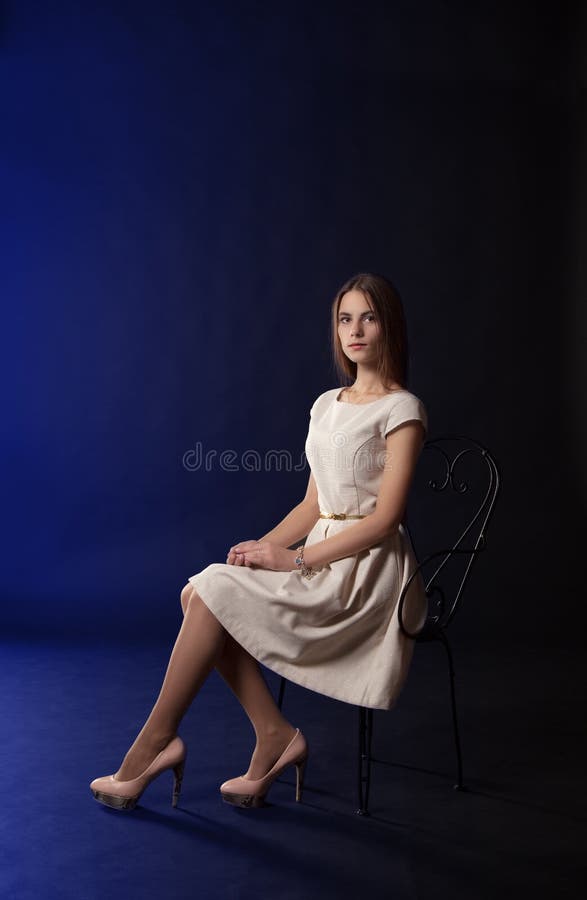 Young girl sitting on a chair