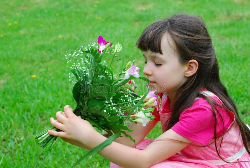 Young Girl Smelling Flowers Stock Image Image of sitting, caucasian