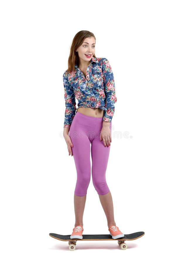 Young girl stands on skateboard, on white background stock photos Young girl stands on skateboard, on white background stock photos