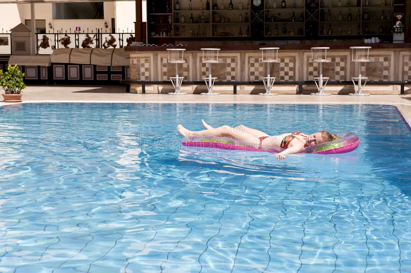 Young girl in swimming pool