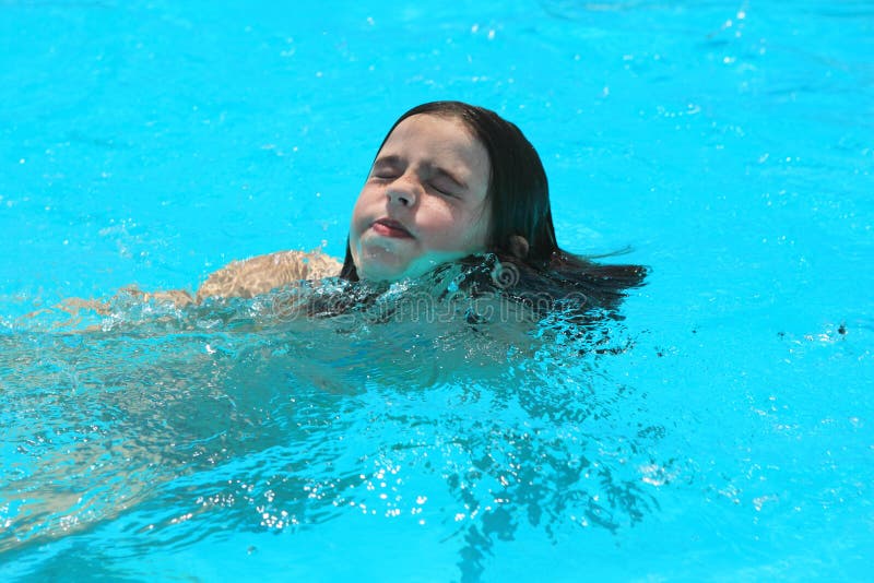 Young Girl swimming in a pool