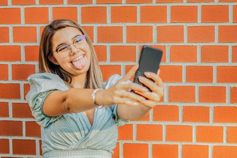 Young Girl Taking a Selfie Smiling at the Camera Happy Student