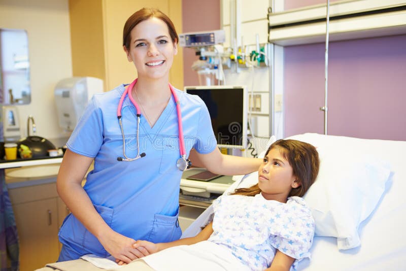 Young Girl Talking To Female Nurse In Hospital Room