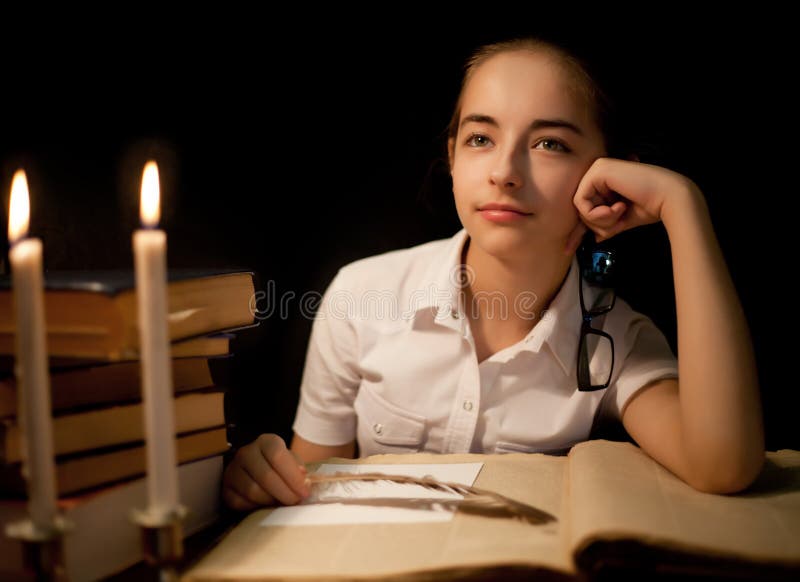 Young girl thinking about book at library