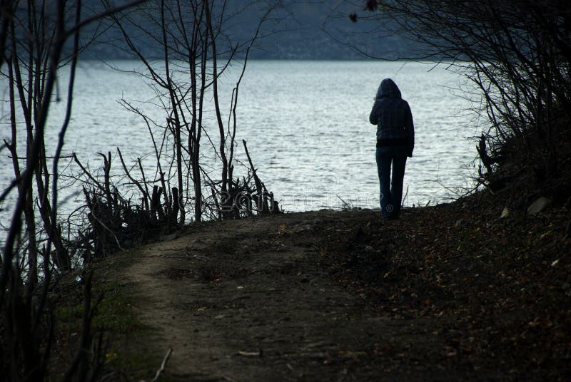 Young Woman in Front of a Lake stock photography Young Woman in Front of a Lake stock photography