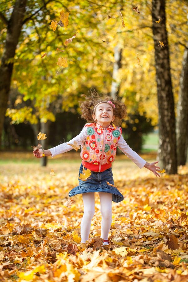 Young Girl Throwing Leaves in Autumn Park Stock Image - Image of maple ...