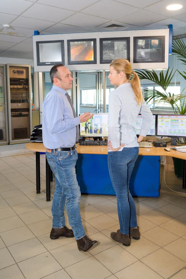 Young girl tv reporter with manager royalty free stock image