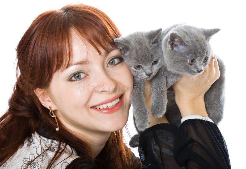 The young girl and two kittens